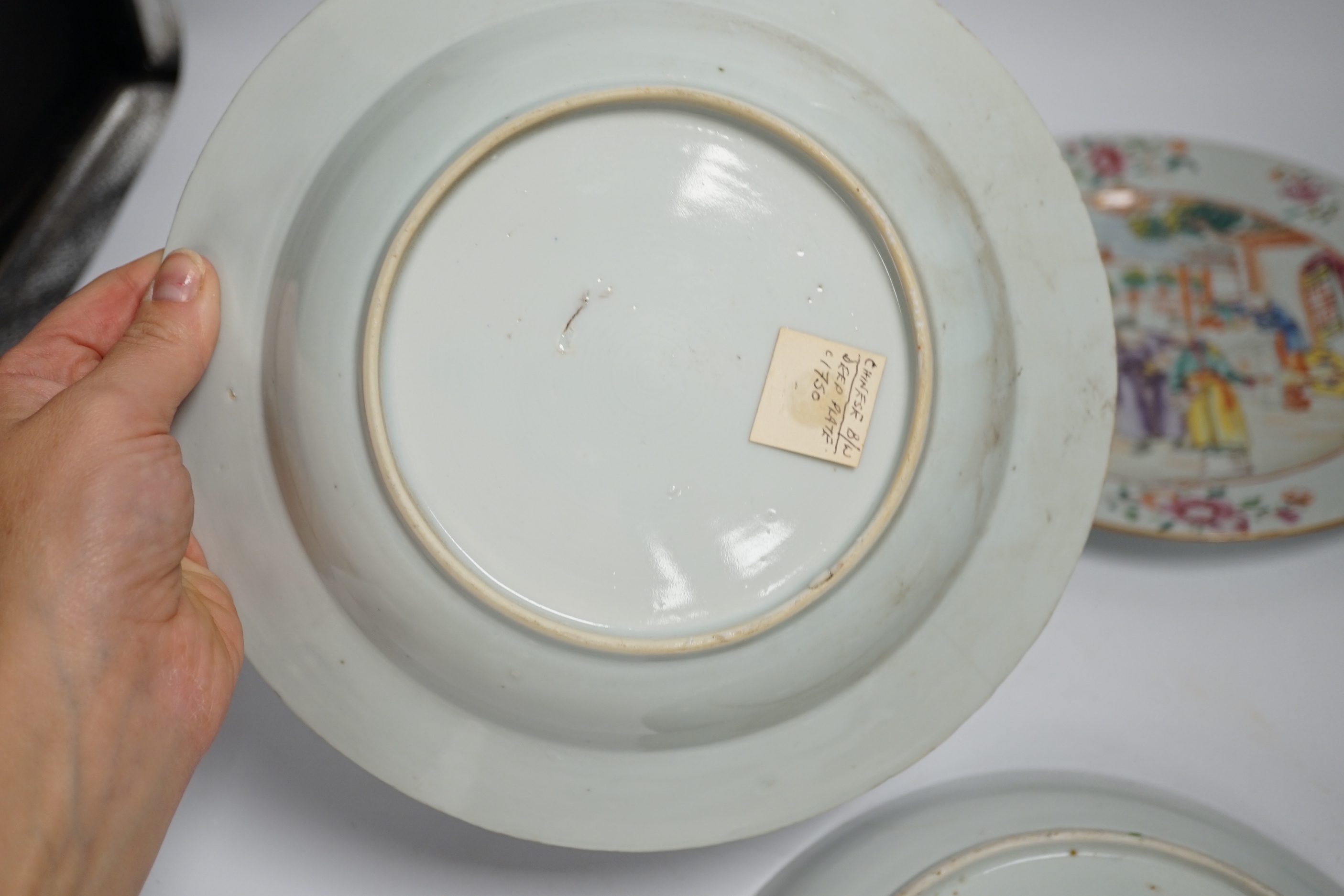 Two 18th century Chinese export plates and a 19th century Canton plate, largest 23cm